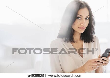 Woman using smart phone View Large Photo Image Stock Image - Woman using smart phone. Fotosearch