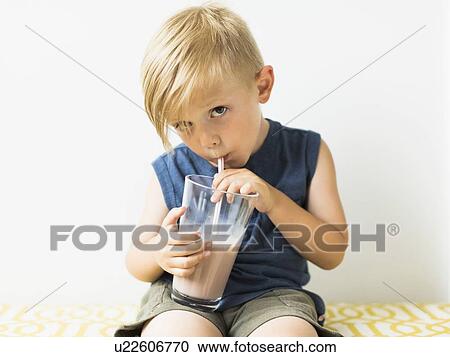 Young boy (2-3) drinking milkshake View Large Photo Image Stock Image - Young boy (2-3) drinking milkshake. Fotosearch