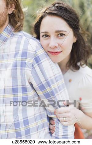 Young smiling woman next to boyfriend View Large Photo Image Stock Image - Young smiling woman next to boyfriend. Fotosearch