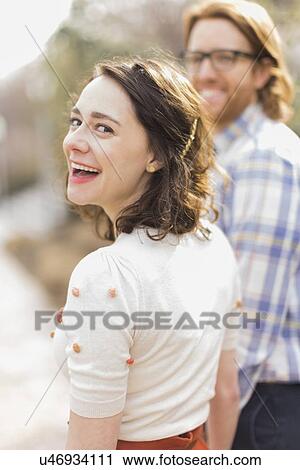 Young smiling woman next to boyfriend View Large Photo Image Stock Image - Young smiling woman next to boyfriend. Fotosearch