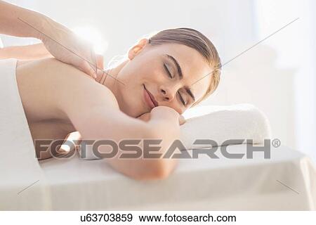 Young woman during massage View Large Photo Image Stock Photo - Young woman during massage. Fotosearch