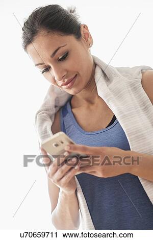 Young woman using smart phone View Large Photo Image Stock Image - Young woman using smart phone. Fotosearch