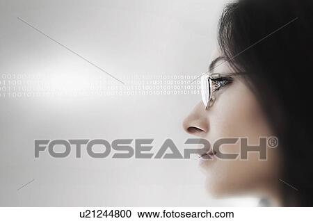 Stock Image - Young woman wearing spectacles. Fotosearch