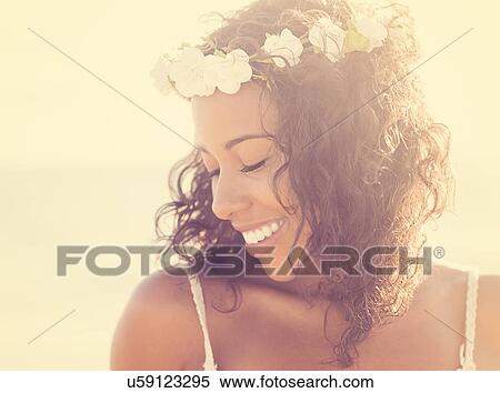 Stock Photography - Young woman wearing wreath. Fotosearch
