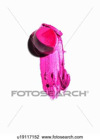 Stock Image - Abstract of piece of pink lipstick and smudge. Fotosearch