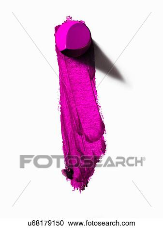 Stock Image - Abstract of piece of pink lipstick and smudged line. Fotosearch