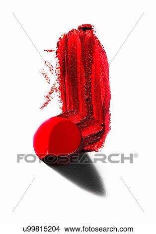 Picture - Abstract of piece of red lipstick with smudged line. Fotosearch