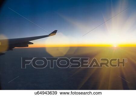 Aeroplane wing seen from inside aeroplane View Large Photo Image Stock Photo - Aeroplane wing seen from inside aeroplane. Fotosearch