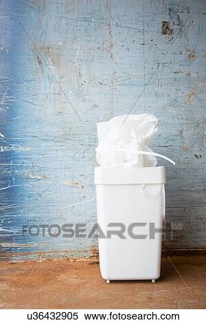 Bin full of paper for recycling in front of wall View Large Photo Image Stock Photography - Bin full of paper for recycling in front of wall. Fotosearch