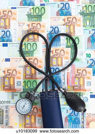Blood pressure gauge on top of euro currency notes, tubes twisted into heart shape View Large Photo Image Stock Photo - Blood pressure gauge on top of euro currency notes, tubes twisted into heart shape. Fotosearch