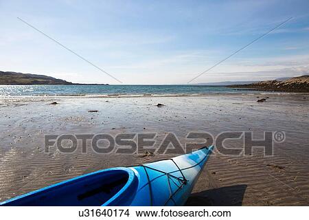 Blue canoe on beach, Loch Eishort, Isle of Skye, Hebrides, Scotland View Large Photo Image Picture - Blue canoe on beach, Loch Eishort, Isle of Skye, Hebrides, Scotland. Fotosearch