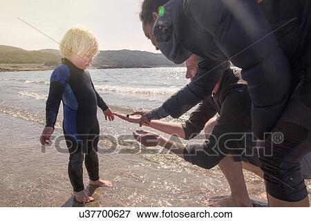 Boy and parents on beach, Loch Eishort, Isle of Skye, Scotland View Large Photo Image Stock Photo - Boy and parents on beach, Loch Eishort, Isle of Skye, Scotland. Fotosearch