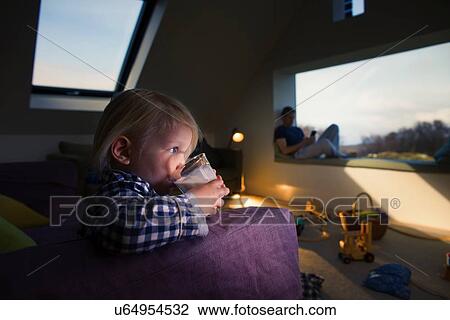 Boy holding glass, drinking View Large Photo Image Stock Image - Boy holding glass, drinking. Fotosearch