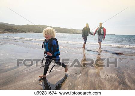 Boy running on beach, Loch Eishort, Isle of Skye, Hebrides, Scotland View Large Photo Image Picture - Boy running on beach, Loch Eishort, Isle of Skye, Hebrides, Scotland. Fotosearch
