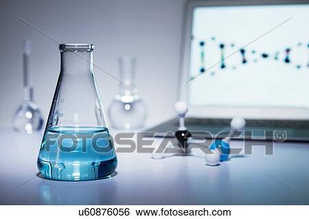 Chemistry research. Erlenmeyer flask containing colored liquid, a ball-and-stick molecular model and laptop computer View Large Photo Image Stock Photograph - Chemistry research. Erlenmeyer flask containing colored liquid, a ball-and-stick molecular model and laptop computer. Fotosearch