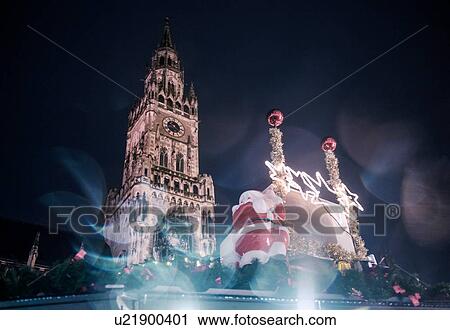Stock Image - Christmas decoration and The New Rathaus (Town Hall) in Marienplatz, Munich, Germany. Fotosearch
