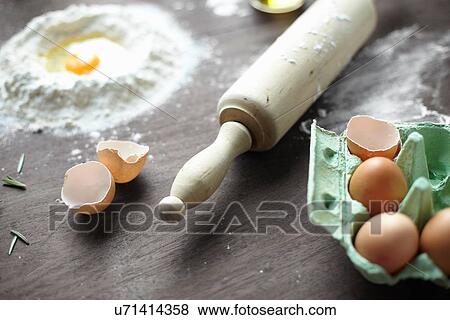 Stock Photo - Close up of baking preparation with flour and eggs. Fotosearch