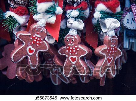 Stock Photography - Close up of gingerbread men xmas decorations on German Christmas market stall. Fotosearch