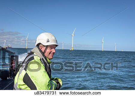 Crew member on deck of boat on offshore wind farm View Large Photo Image Stock Image - Crew member on deck of boat on offshore wind farm. Fotosearch