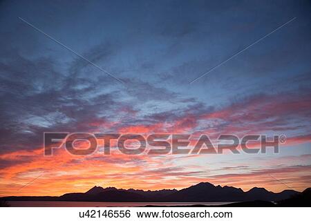 Stock Photograph - Cuillin mountains at sunset, Isle of Skye, Hebrides, Scotland. Fotosearch