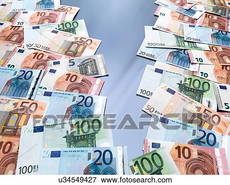 Euro currency notes split into two piles View Large Photo Image Stock Photo - Euro currency notes split into two piles. Fotosearch