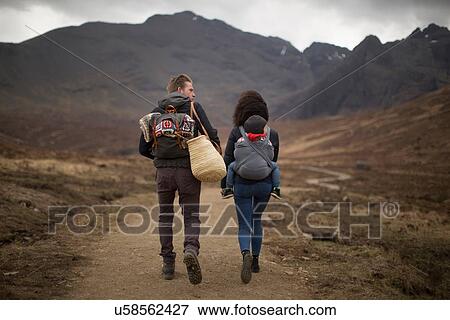 Stock Photo - Family hiking on path, Fairy Pools, near Glenbrittle, Isle of Skye, Hebrides, Scotland. Fotosearch