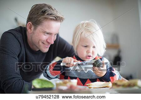 Father andf son preparing food View Large Photo Image Stock Photo - Father andf son preparing food. Fotosearch