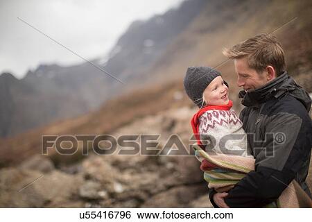 Father holding son, smiling View Large Photo Image Stock Photograph - Father holding son, smiling. Fotosearch