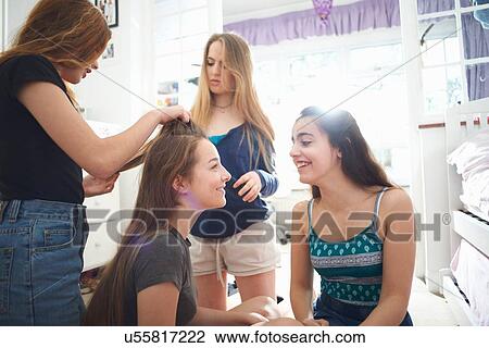Four teenage girls getting ready in bedroom View Large Photo Image Stock Image - Four teenage girls getting ready in bedroom. Fotosearch