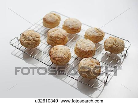 Stock Photo - Freshly baked scones on cooling rack. Fotosearch