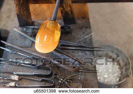 Glassblower tools and molten glass in workshop, close up View Large Photo Image Stock Photo - Glassblower tools and molten glass in workshop, close up. Fotosearch