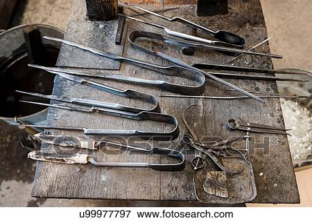Stock Photo - Glassblower tools in workshop, close up. Fotosearch
