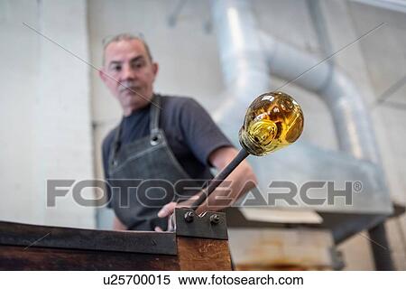 Glassblower with large blob of hot glass View Large Photo Image Stock Photography - Glassblower with large blob of hot glass. Fotosearch