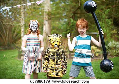 Stock Photo - Group of children wearing fancy dress costumes, portrait. Fotosearch