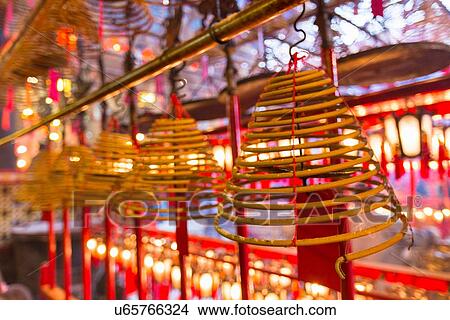 Picture - Incense coils burning in Man Mo Temple, Hong Kong, China. Fotosearch