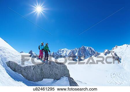 Male and female skiers looking out from ridge on Mont Blanc massif, Graian Alps, France View Large Photo Image Stock Photography - Male and female skiers looking out from ridge on Mont Blanc massif, Graian Alps, France. Fotosearch