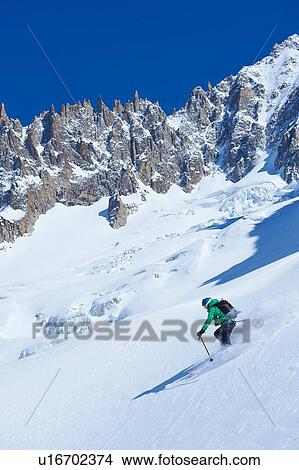 Male skier skiing steep downhill on Mont Blanc massif, Graian Alps, France View Large Photo Image Picture - Male skier skiing steep downhill on Mont Blanc massif, Graian Alps, France. Fotosearch