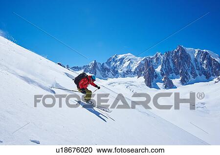 Male skier speeding downhill, Mont Blanc massif, Graian Alps, France View Large Photo Image Stock Image - Male skier speeding downhill, Mont Blanc massif, Graian Alps, France. Fotosearch