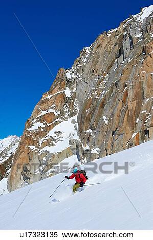 Male skier speeding downhill on Mont Blanc massif, Graian Alps, France View Large Photo Image Stock Photography - Male skier speeding downhill on Mont Blanc massif, Graian Alps, France. Fotosearch
