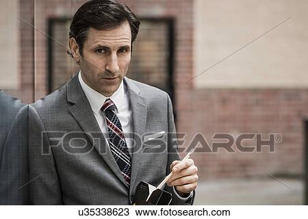 Mature businessman, eating lunch from takeaway box, outdoors View Large Photo Image Stock Image - Mature businessman, eating lunch from takeaway box, outdoors. Fotosearch