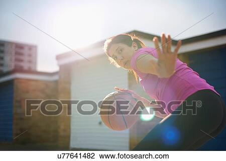 Mature female basketball player practicing defense View Large Photo Image Stock Image - Mature female basketball player practicing defense. Fotosearch