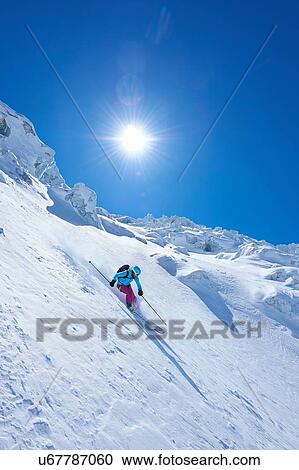 Mature female skier speeding downhill on Mont Blanc massif, Graian Alps, France View Large Photo Image Stock Image - Mature female skier speeding downhill on Mont Blanc massif, Graian Alps, France. Fotosearch