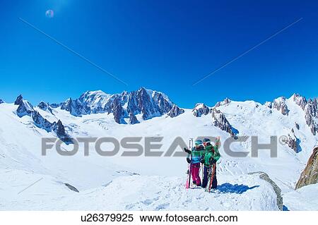 Mature male and female skiers on ridge at Mont Blanc massif, Graian Alps, France View Large Photo Image Stock Photography - Mature male and female skiers on ridge at Mont Blanc massif, Graian Alps, France. Fotosearch