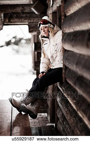 Mid adult woman by chalet, portrait View Large Photo Image Stock Photo - Mid adult woman by chalet, portrait. Fotosearch