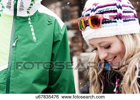 Mid adult woman wearing knit hat, looking down View Large Photo Image Stock Photograph - Mid adult woman wearing knit hat, looking down. Fotosearch