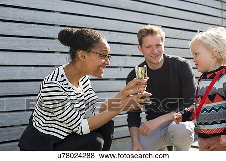 Mother giving son trophy View Large Photo Image Stock Photo - Mother giving son trophy. Fotosearch