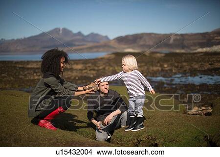 Mother showing son rock, Isle of Skye, Hebrides, Scotland View Large Photo Image Picture - Mother showing son rock, Isle of Skye, Hebrides, Scotland. Fotosearch