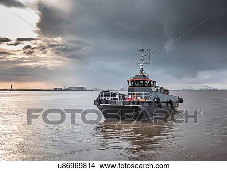 Picture - Offshore wind farm service tender boat. Fotosearch