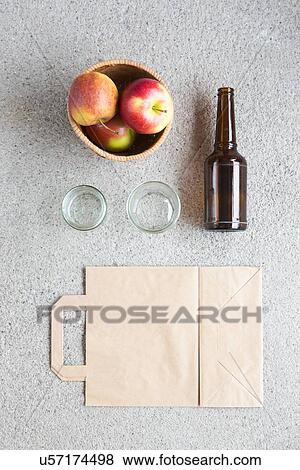 Overhead still life of apples, recyclable bag and bottle View Large Photo Image Stock Photo - Overhead still life of apples, recyclable bag and bottle. Fotosearch