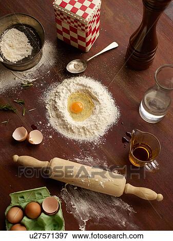 Overhead view of baking preparation with flour and eggs View Large Photo Image Stock Photo - Overhead view of baking preparation with flour and eggs. Fotosearch